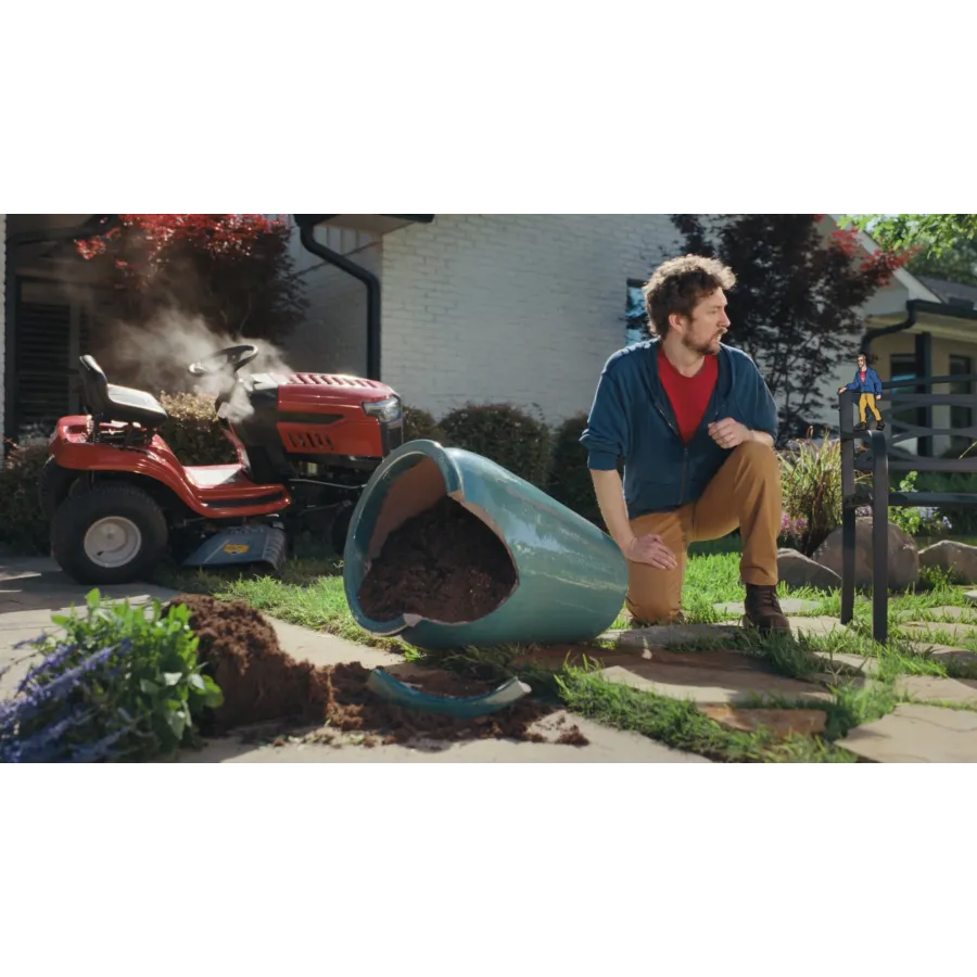 a man sitting on a wheelbarrow