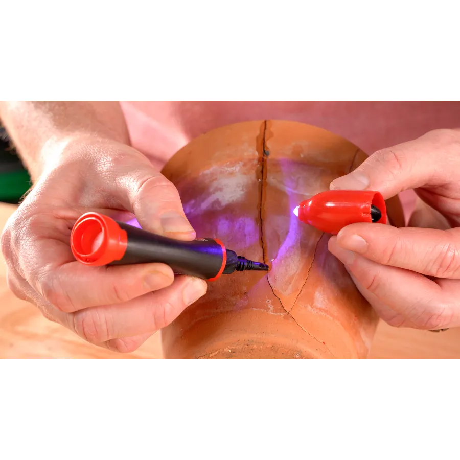 a person painting a red substance