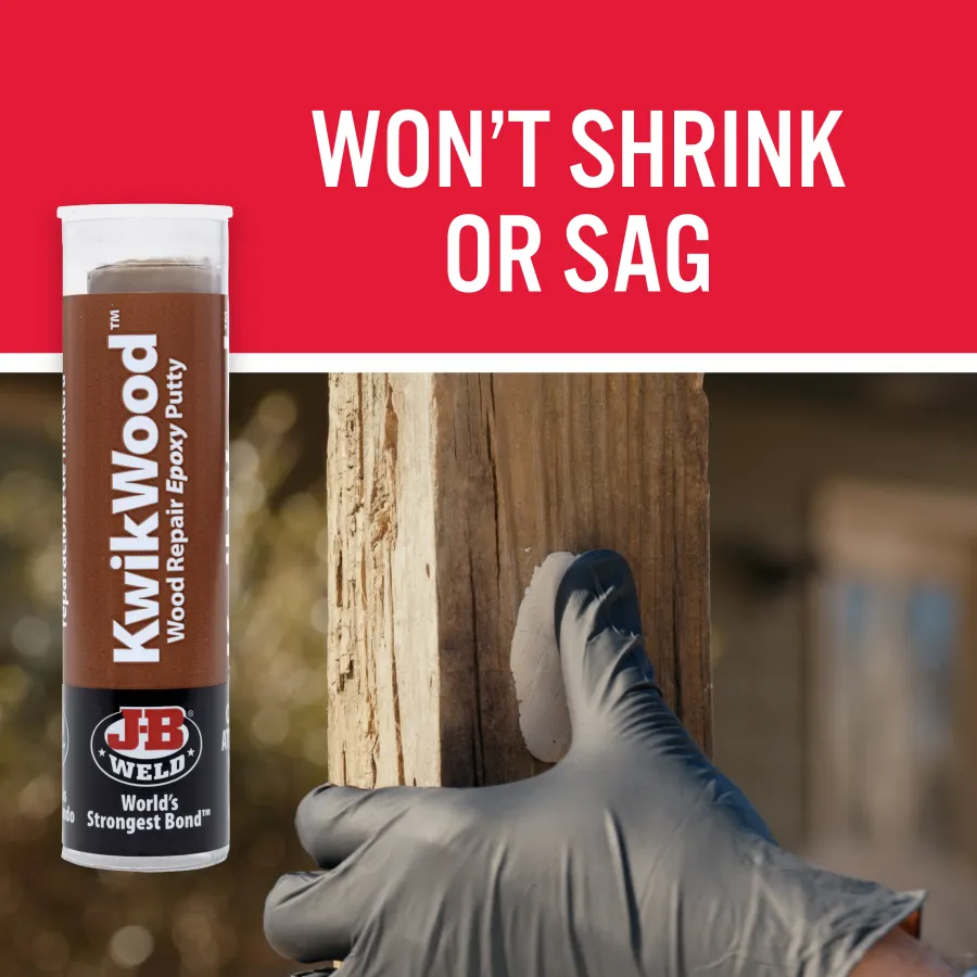 a hand holding a bottle of alcohol